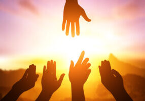 Silhouette,Of,Helping,Hand,Concept,And,International,Day,Of,Peace.how